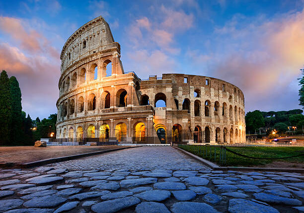 View of Colosseum in Rome and morning sun, Italy, Europe.